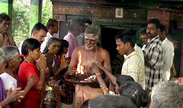 Brahmin offers sacred fire